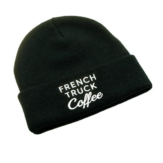 Black knit beanie with white French Truck Coffee logo, ideal for cold days